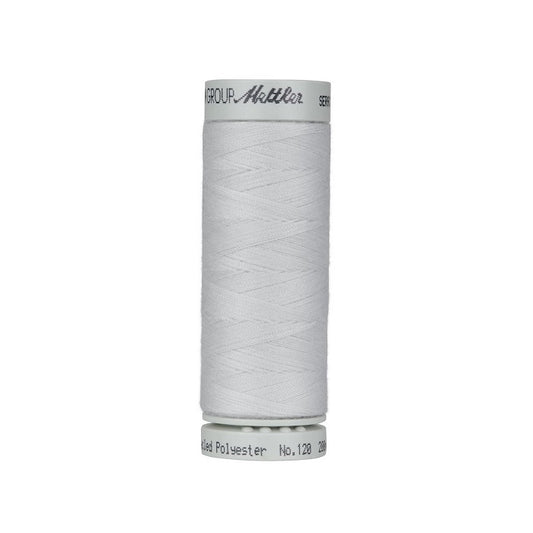 Spool of silver grey thread with Mettler Seracycle branding.