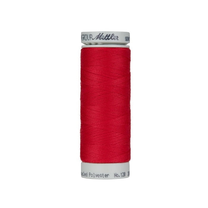 Spool of red thread with Mettler Seracycle branding.