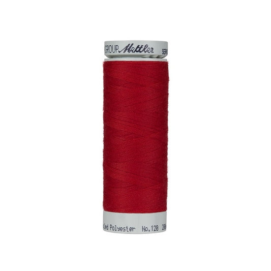 Spool of red thread with Mettler Seracycle branding.