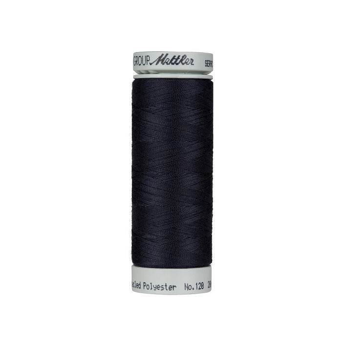 Spool of navy blue thread with Mettler Seracycle branding.