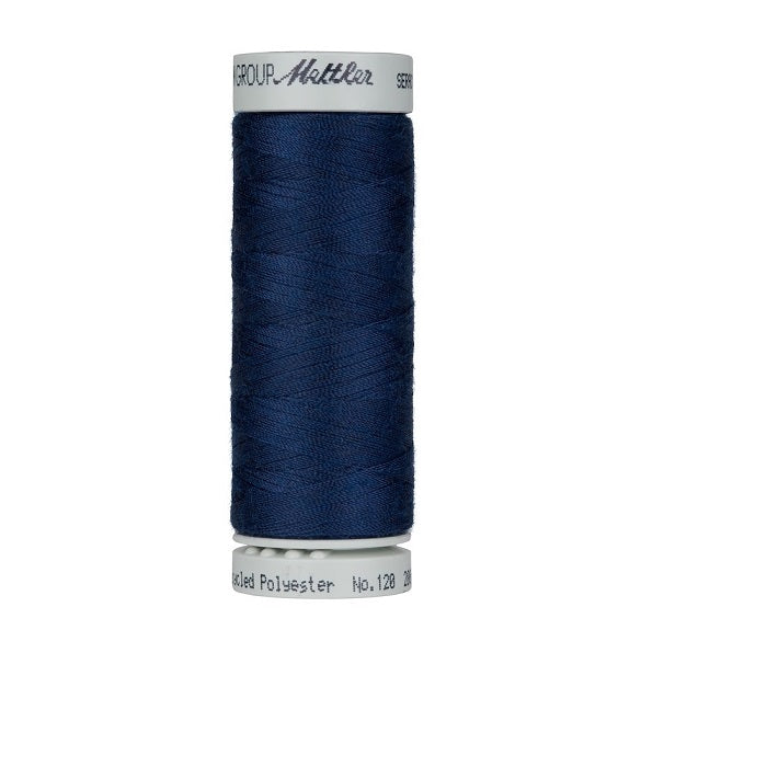 Spool of navy thread with Mettler Seracycle branding.
