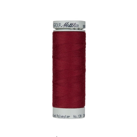 Spool of cranberry red thread with Mettler Seracycle branding.
