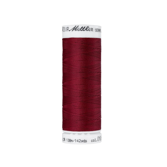 Spool of dark red thread with Mettler Seraflex branding.