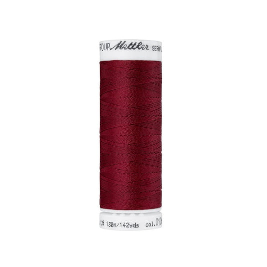 Spool of dark red thread with Mettler Seraflex branding.