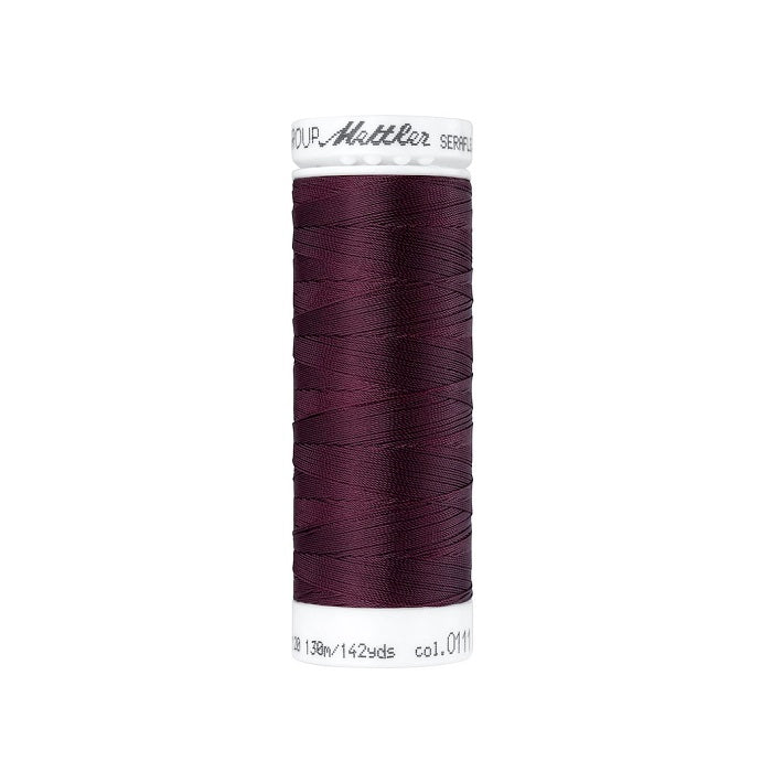Spool of deep red thread with Mettler Seraflex branding.