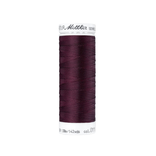 Spool of deep red thread with Mettler Seraflex branding.