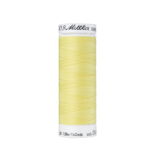 Spool of light yellow thread with Mettler Seraflex branding.
