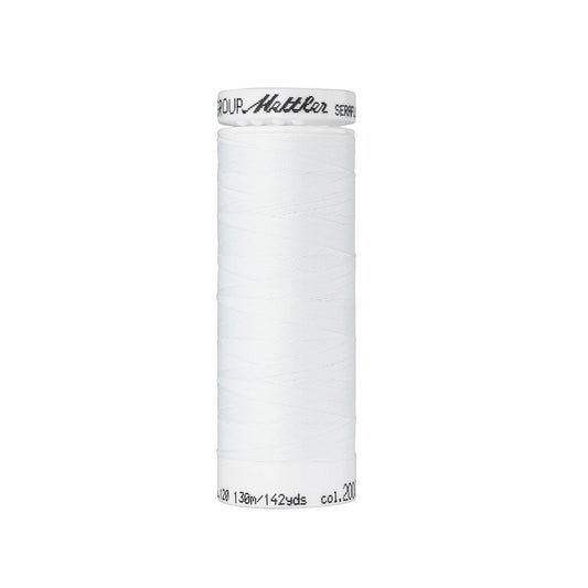 Spool of white thread with Mettler Seraflex branding.