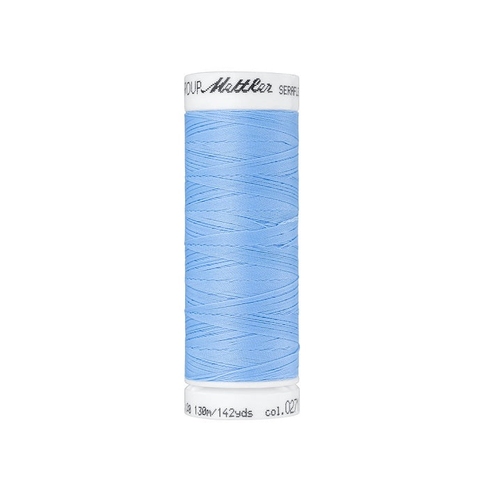 Spool of light blue thread with Mettler Seraflex branding.