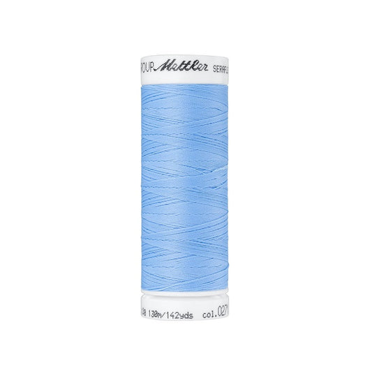 Spool of light blue thread with Mettler Seraflex branding.