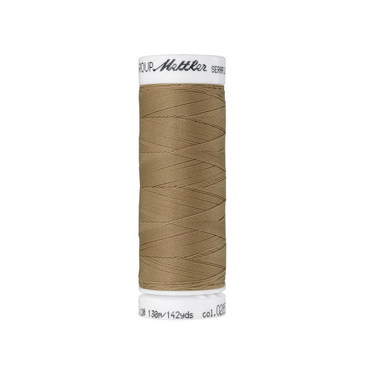 Spool of tan brown thread with Mettler Seraflex branding.