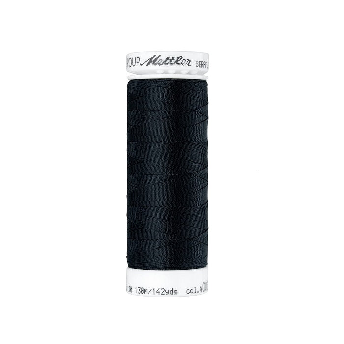 Spool of black thread with Mettler Seraflex branding.