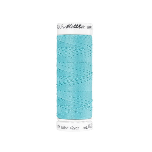 Spool of light aqua thread with Mettler Seraflex branding.