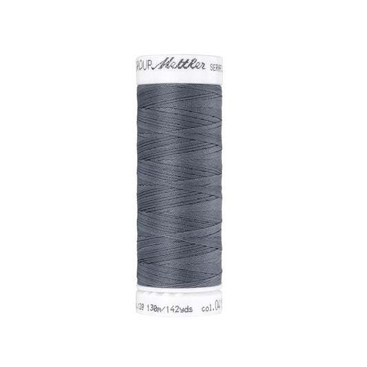 Spool of grey thread with Mettler Seraflex branding.