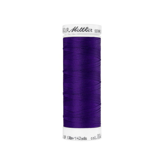 Spool of purple thread with Mettler Seraflex branding.