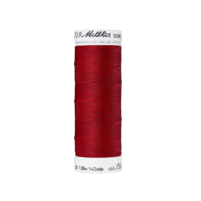 Spool of red thread with Mettler Seraflex branding.