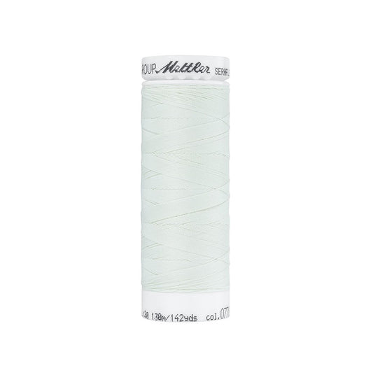 Spool of very pale blue thread with Mettler Seraflex branding.