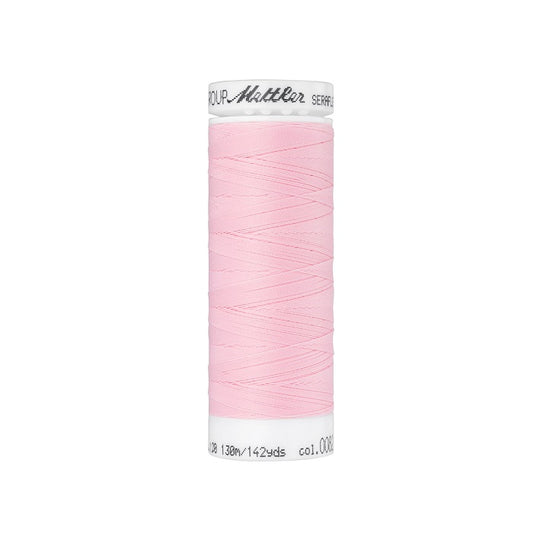 Spool of pink thread with Mettler Seraflex branding.