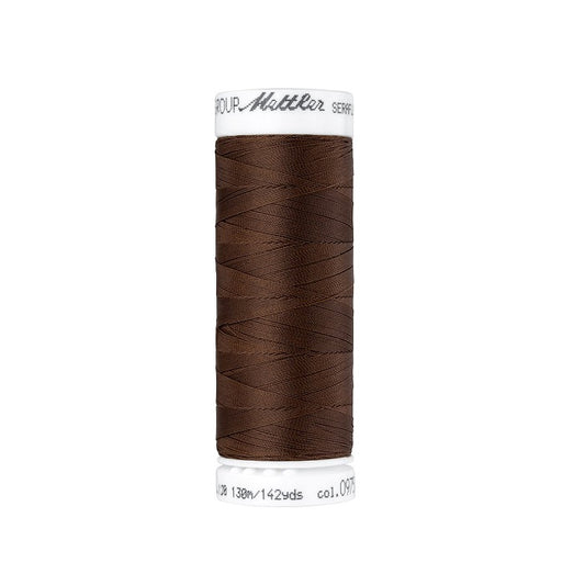 Spool of dark brown thread with Mettler Seraflex branding.