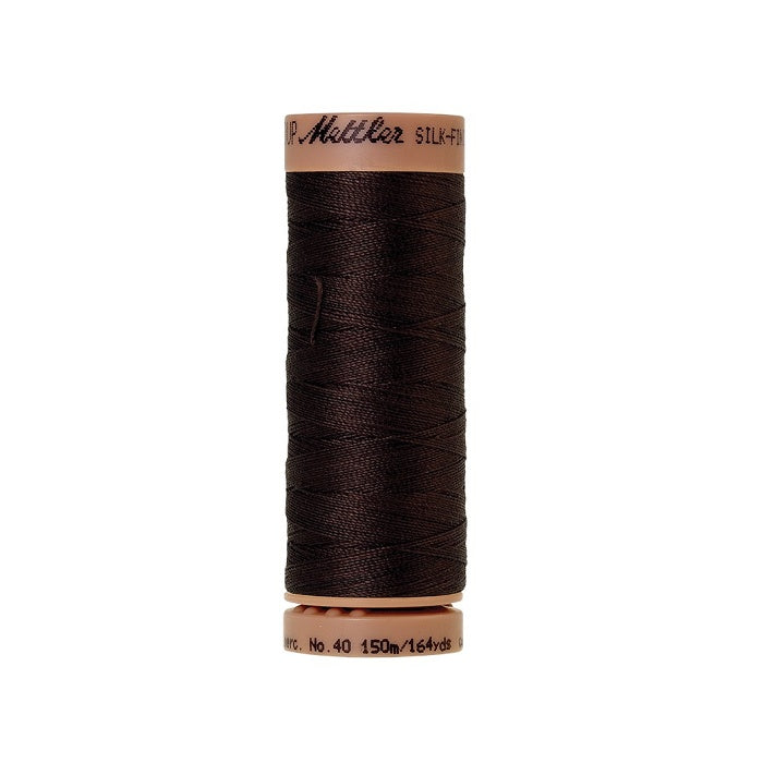 Very dark brown thread with Mettler Cotton 40 branding.