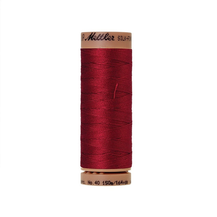 Dark red thread with Mettler Cotton 40 branding.