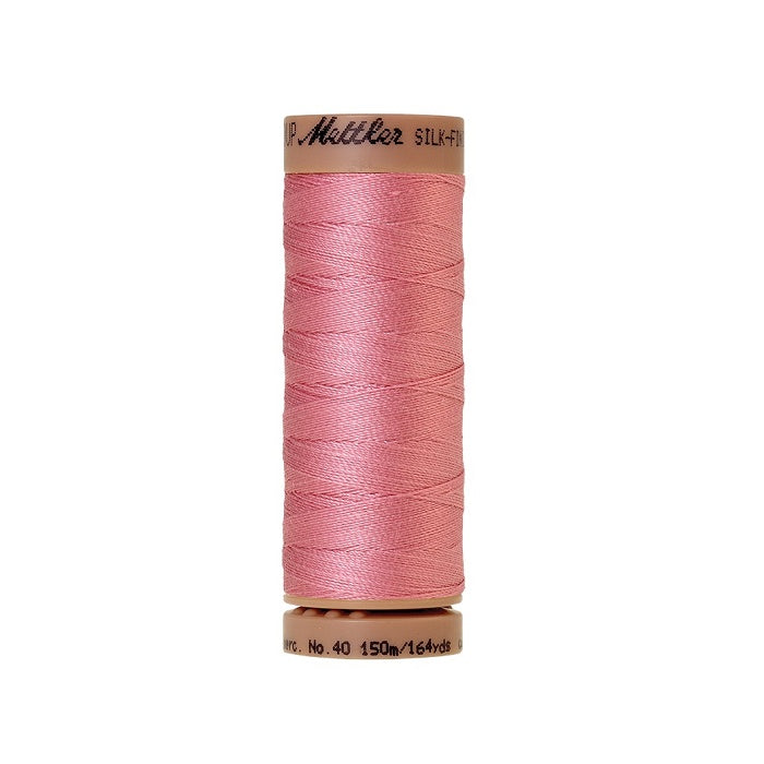 Pink thread with Mettler Cotton 40 branding.