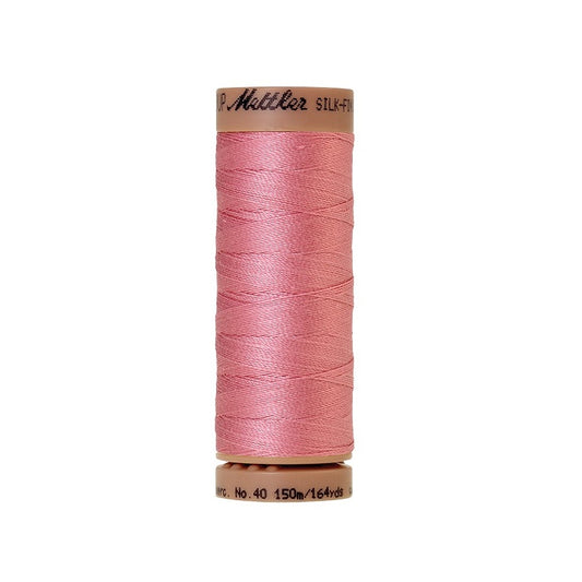 Pink thread with Mettler Cotton 40 branding.