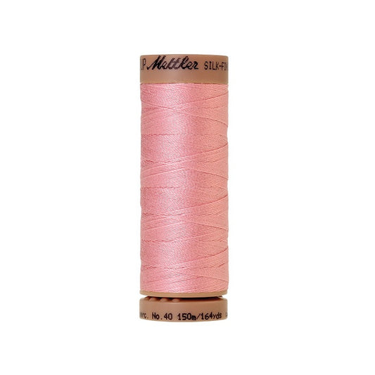 Pink thread with Mettler Cotton 40 branding.
