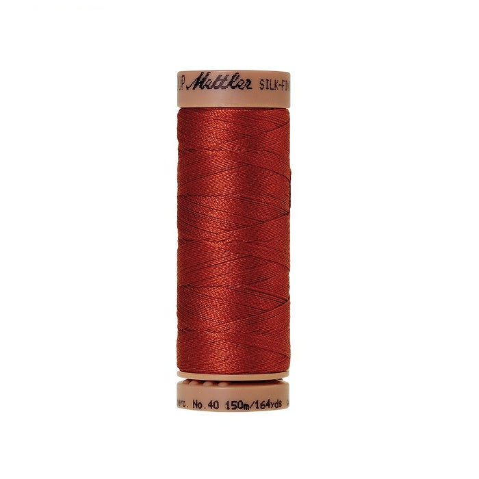 Red thread with Mettler Cotton 40 branding.