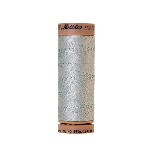 Grey thread with Mettler Cotton 40 branding.
