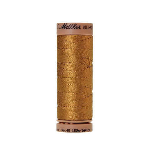Brown thread with Mettler Cotton 40 branding.
