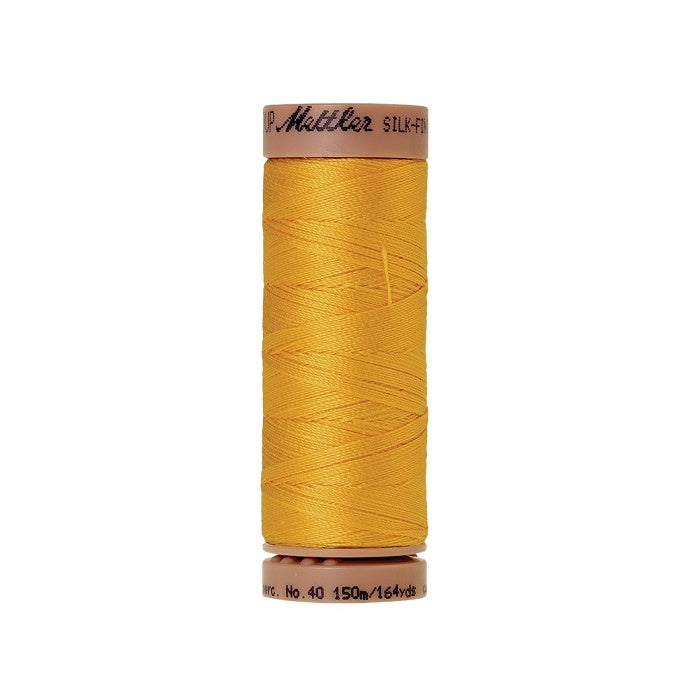 Yellow thread with Mettler Cotton 40 branding.