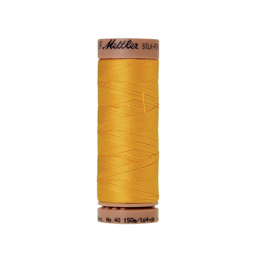 Yellow thread with Mettler Cotton 40 branding.