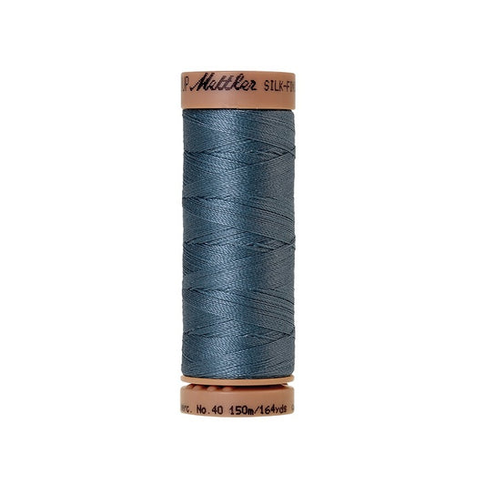Blue thread with Mettler Cotton 40 branding.