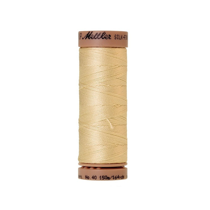 Beige thread with Mettler Cotton 40 branding.