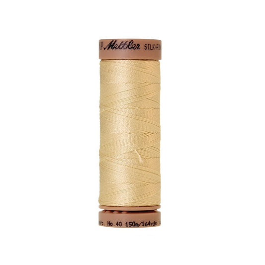 Beige thread with Mettler Cotton 40 branding.