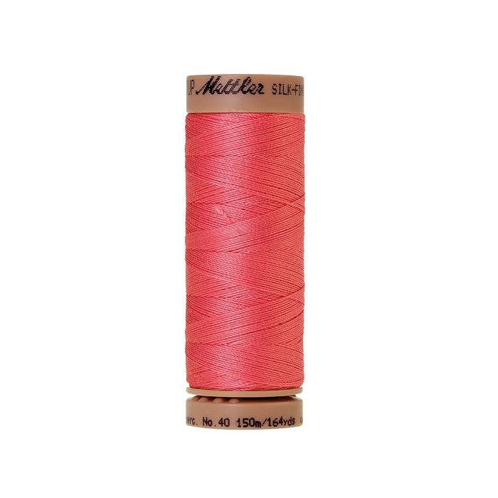 Reddish pink thread with Mettler Cotton 40 branding.