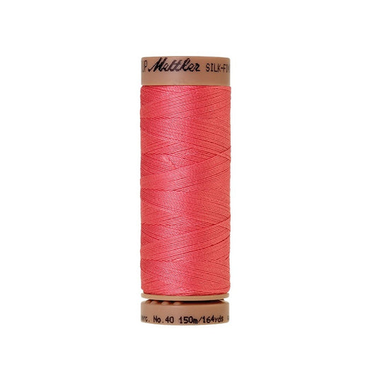 Reddish pink thread with Mettler Cotton 40 branding.