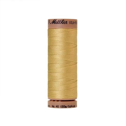 Yellow thread with Mettler Cotton 40 branding.