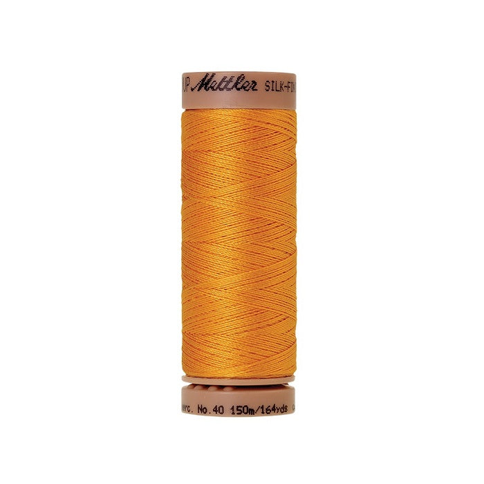 Dark yellow thread with Mettler Cotton 40 branding.