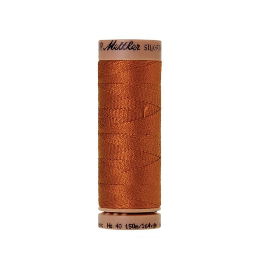 Copper thread with Mettler Cotton 40 branding.