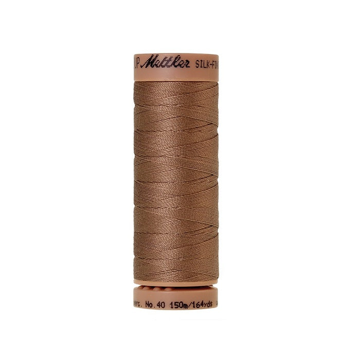Brown thread with Mettler Cotton 40 branding.