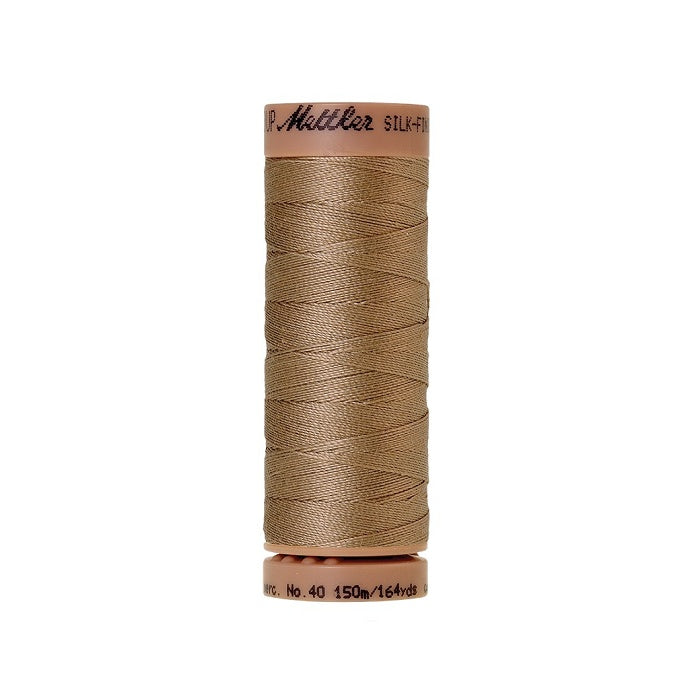 Beige thread with Mettler Cotton 40 branding.