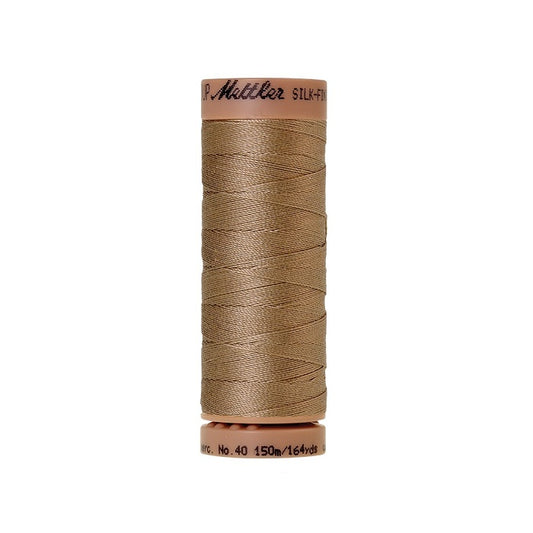 Beige thread with Mettler Cotton 40 branding.