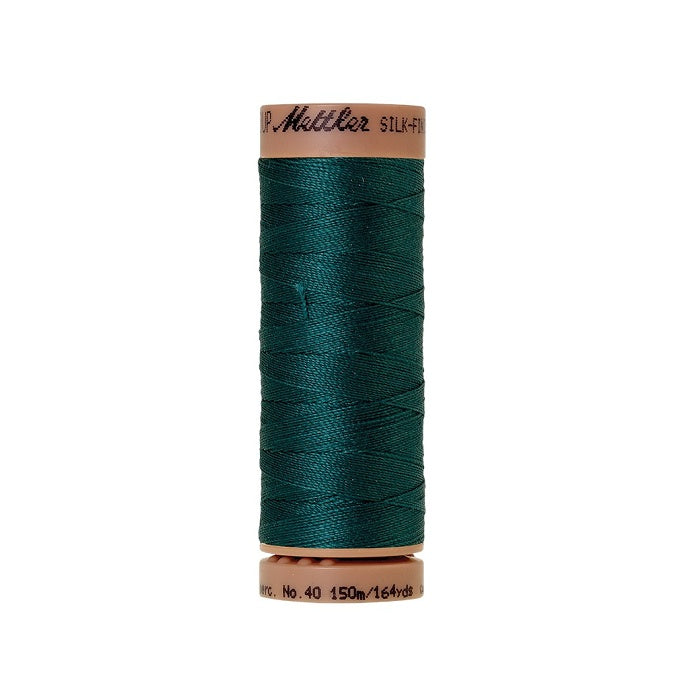 Dark green thread with Mettler Cotton 40 branding.