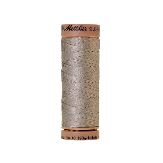Grey thread with Mettler Cotton 40 branding.