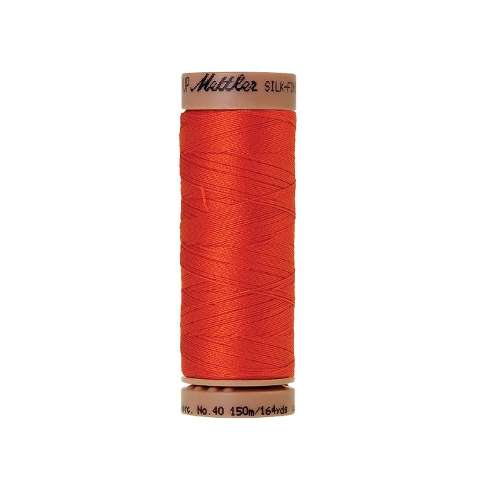 Orange thread with Mettler Cotton 40 branding.