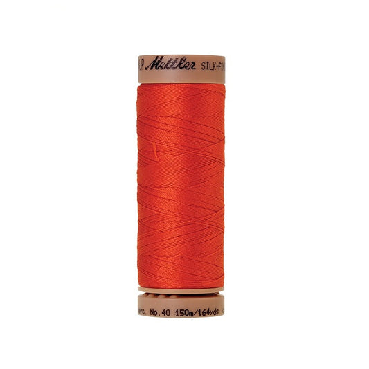 Orange thread with Mettler Cotton 40 branding.