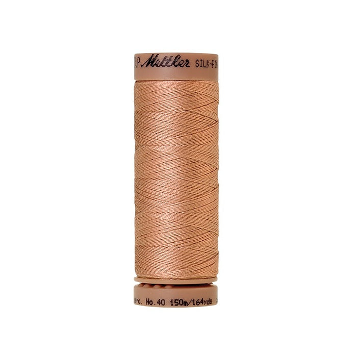 Beige thread with Mettler Cotton 40 branding.