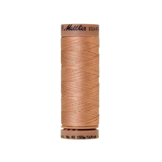 Beige thread with Mettler Cotton 40 branding.